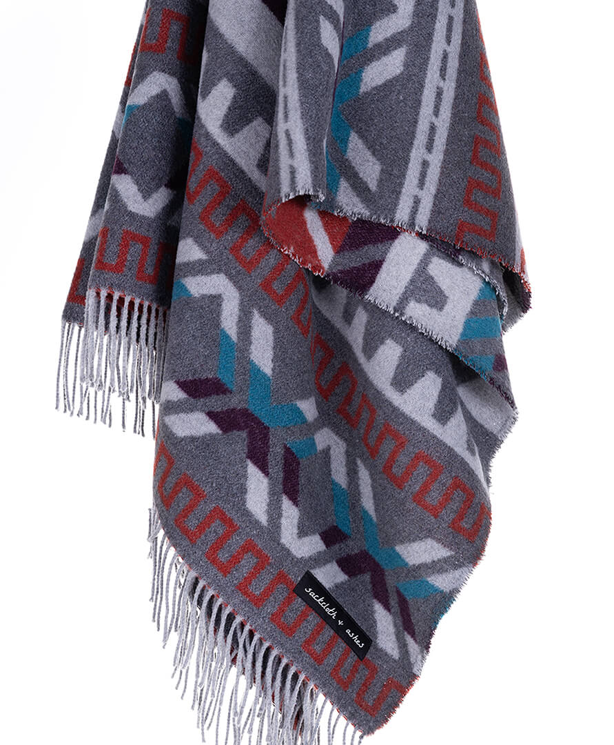 Patterned scarf with fringes on a white background
