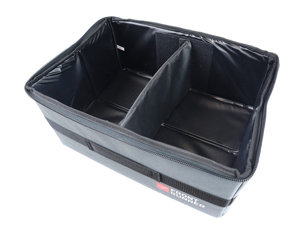 Gray and black storage bin with compartments on a white background