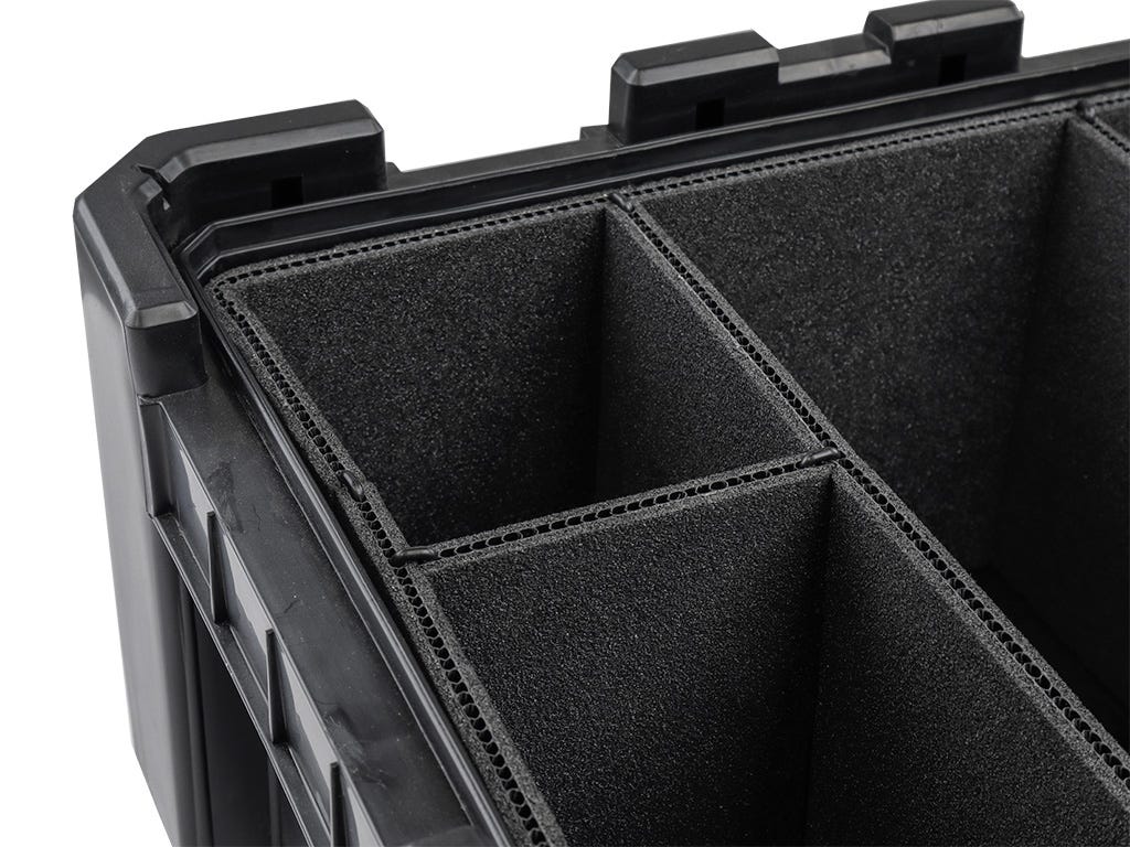 Black foam-lined storage case with compartments