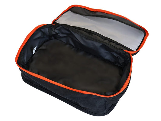 Black travel bag with orange trim on a white background