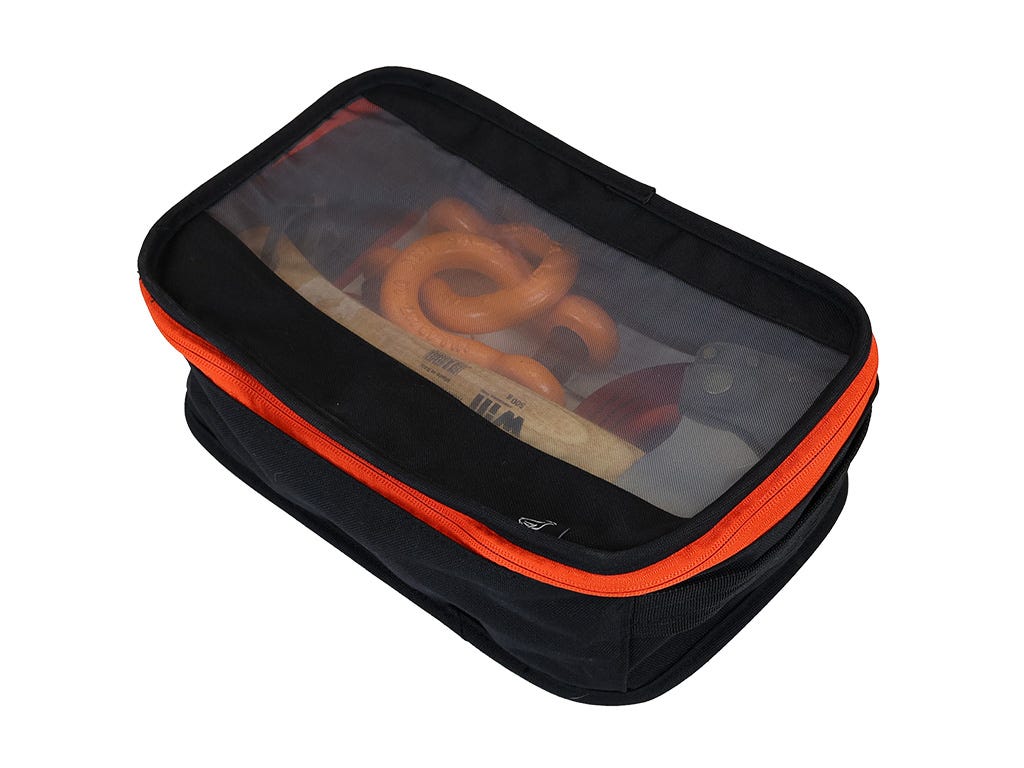 Black and orange travel pouch with clear lid showing contents on a white background