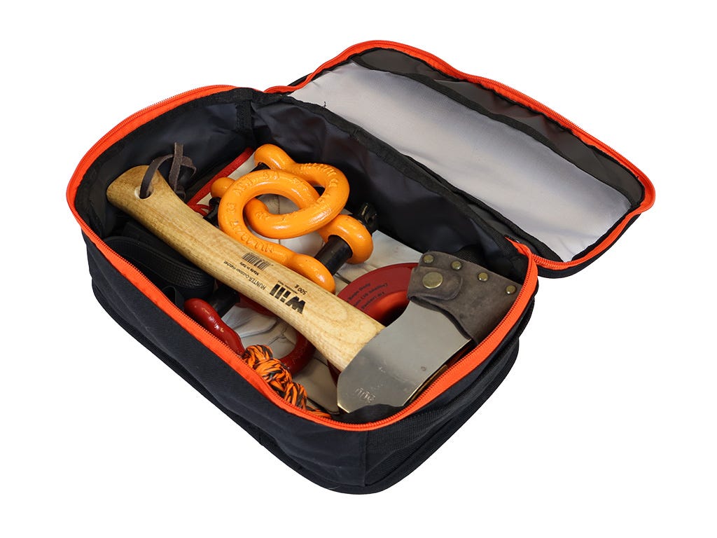 Open black and orange tool case with axes and tools on a white background