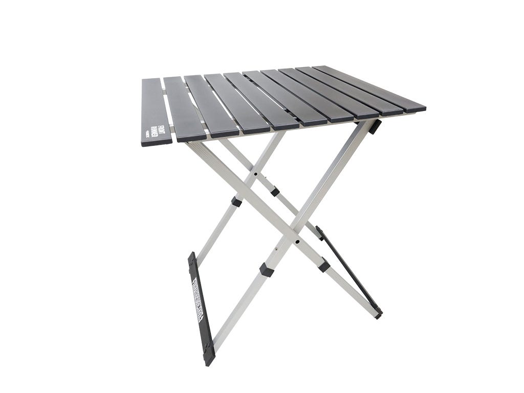Foldable camping table with gray top and white legs on a white background