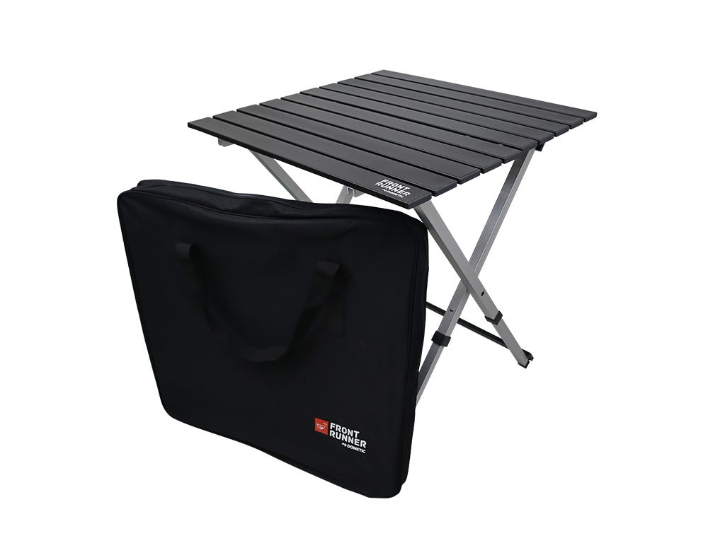 Foldable camping table with carrying bag on a white background