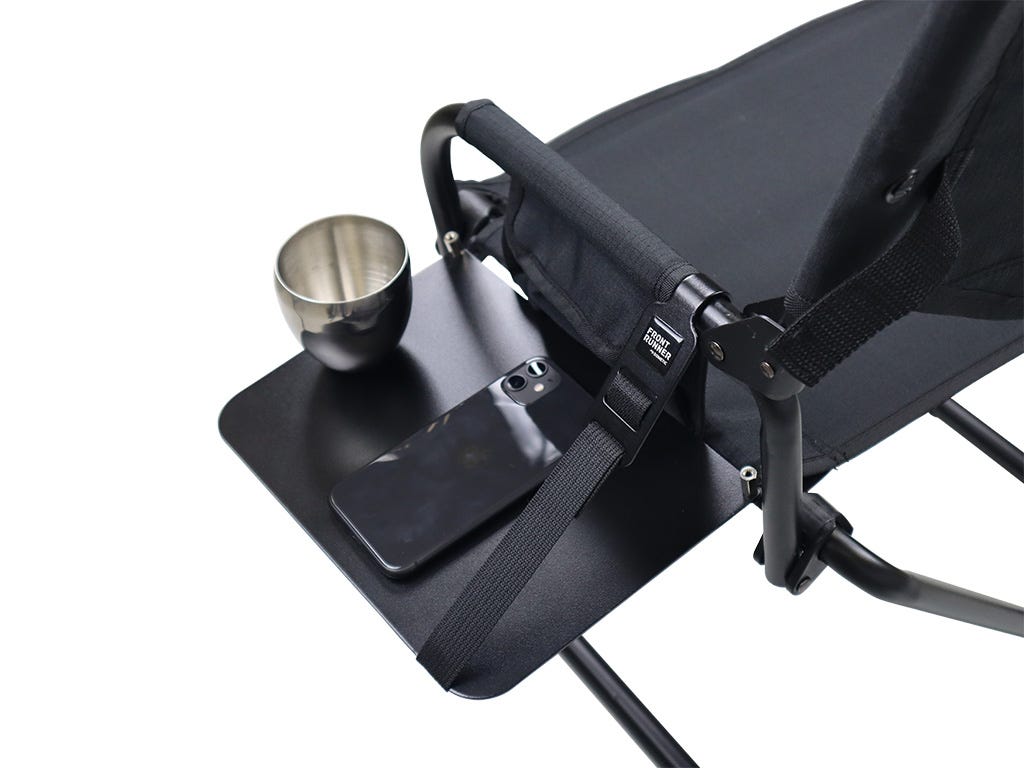 Black camping chair with cup holder and tray on a white background