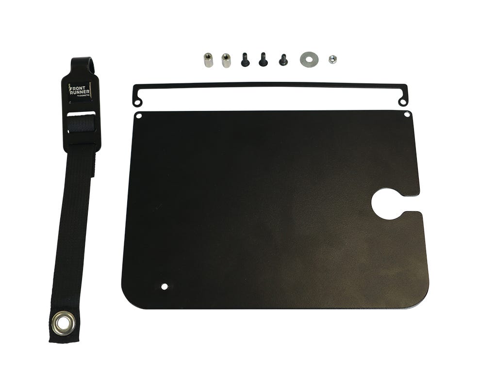 Black metal plate with straps and small components on a white background